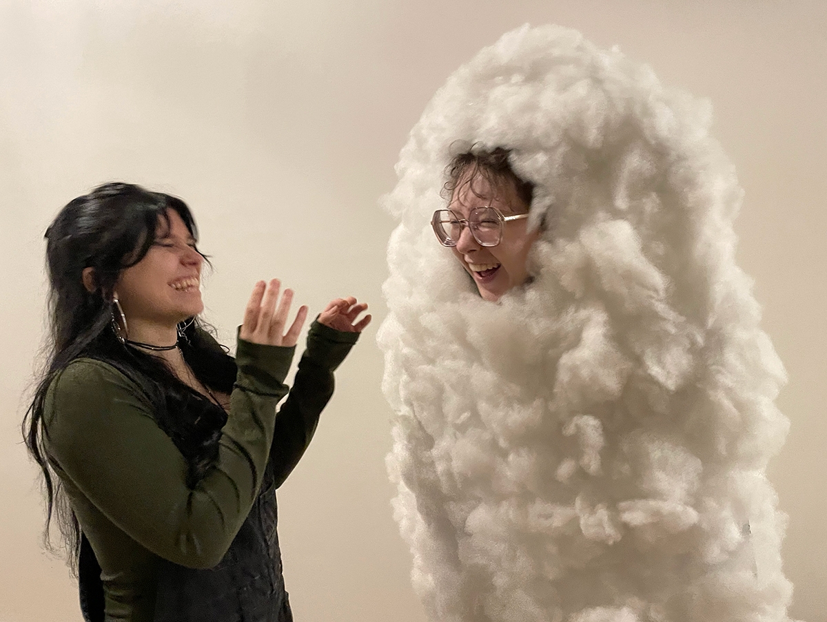 Student laughs dressed in cloud costume