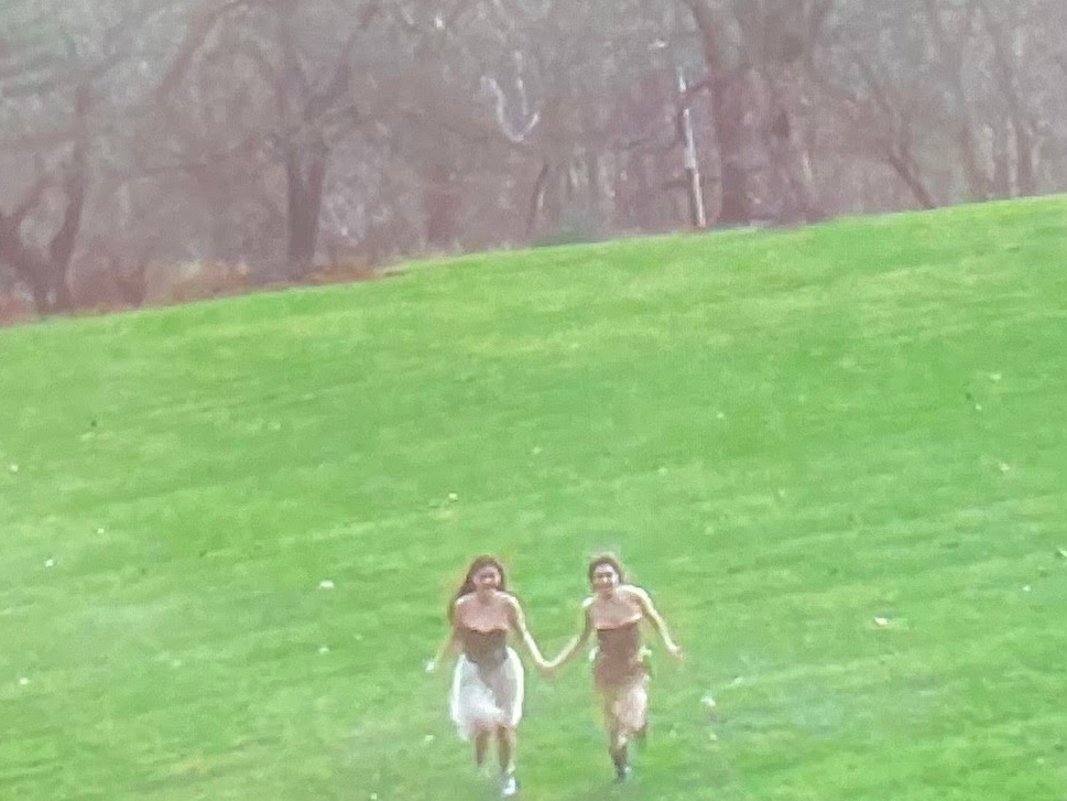 people running in an open field