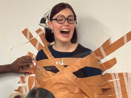 Student taped to a wall
