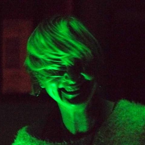 A photo of Cari Ann in a green hue