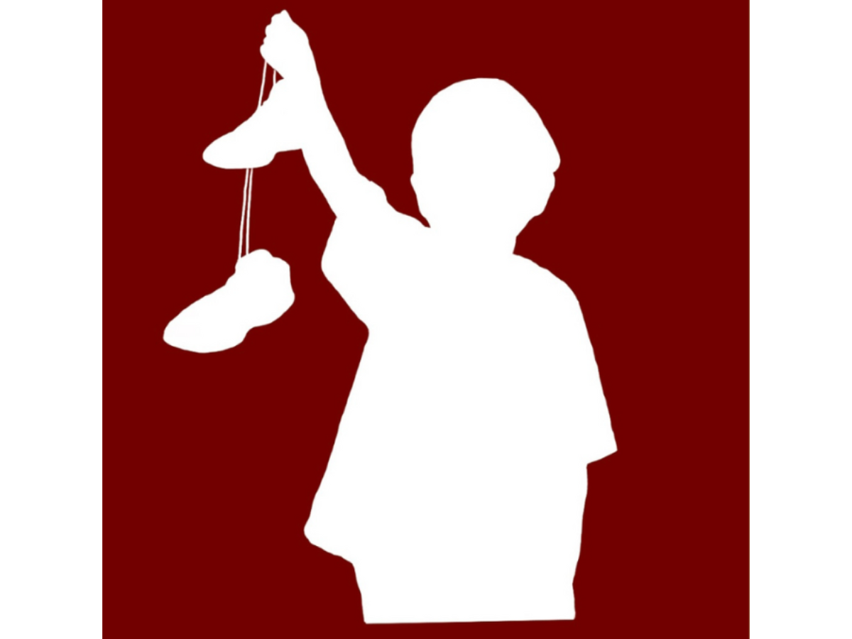 White silhouette of figure on dark red background holding a pair of tied-together shoes dangling in front of them
