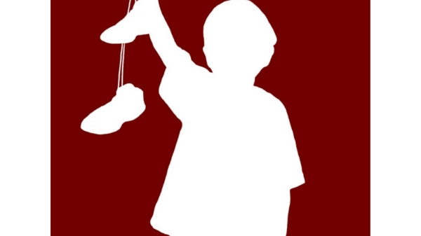 White silhouette of figure on dark red background holding a pair of tied-together shoes dangling in front of them