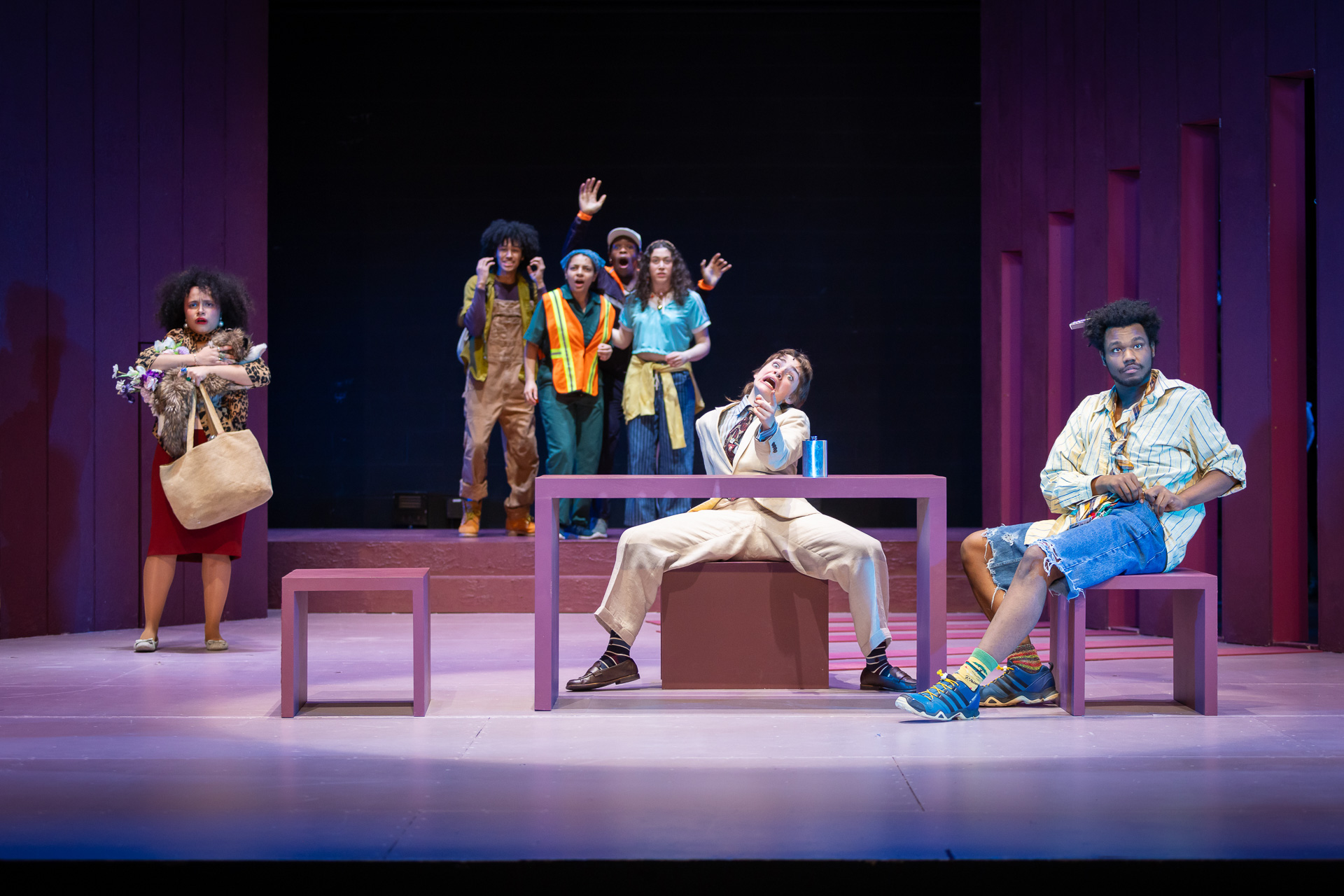 a group of people onstage looking towards the camera