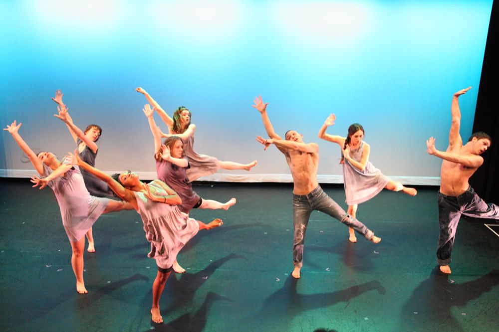 Students mid-performance in The diSPlACEment Project"