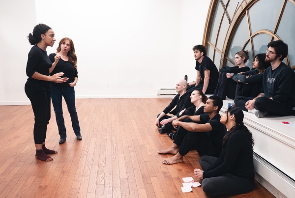 Actors pose mid-scene