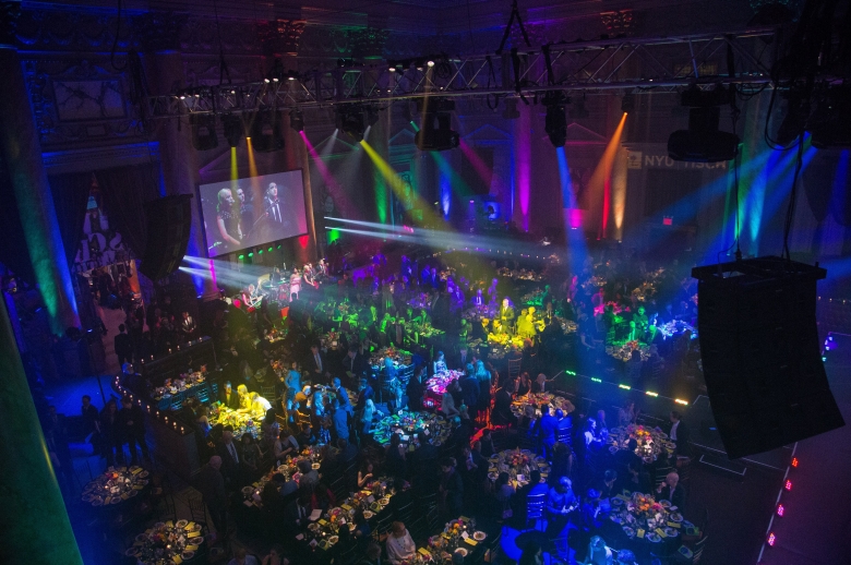 An overhead shot of multi-colored lights illuminating the room at the 2018 Tisch Gala