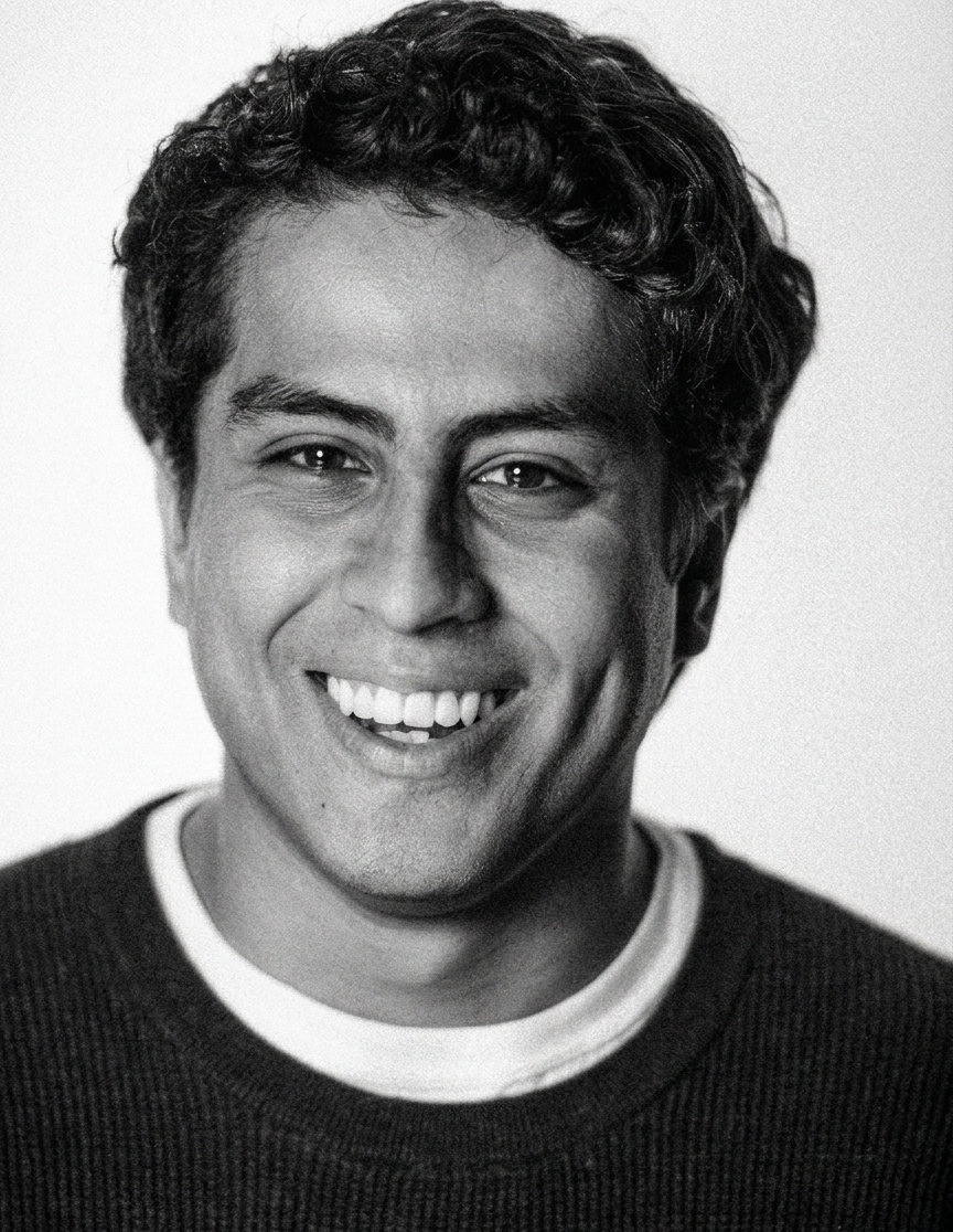 black and white photo with smiling student. 