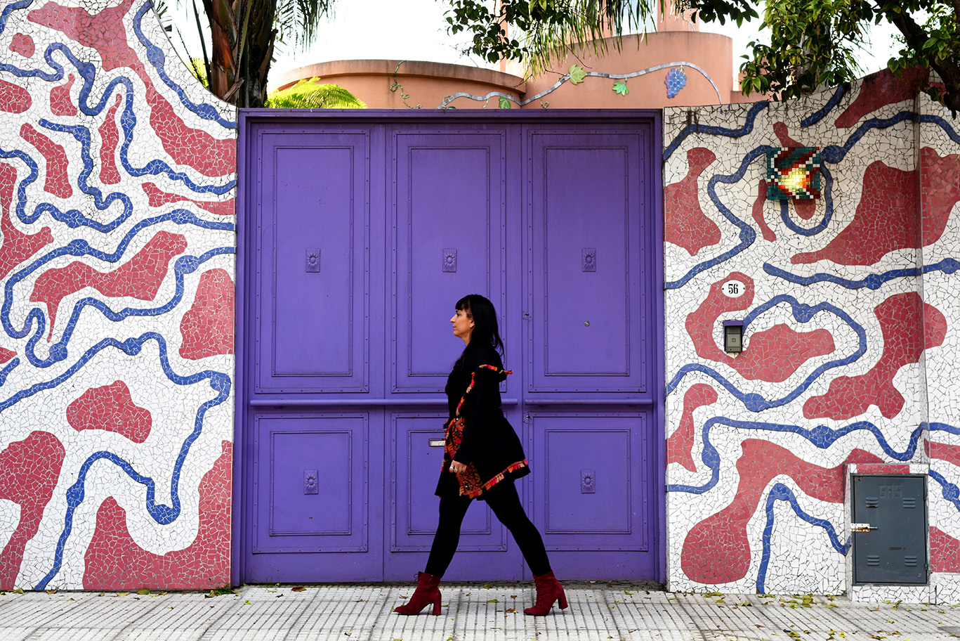 Sofia Rei in front of a purple door