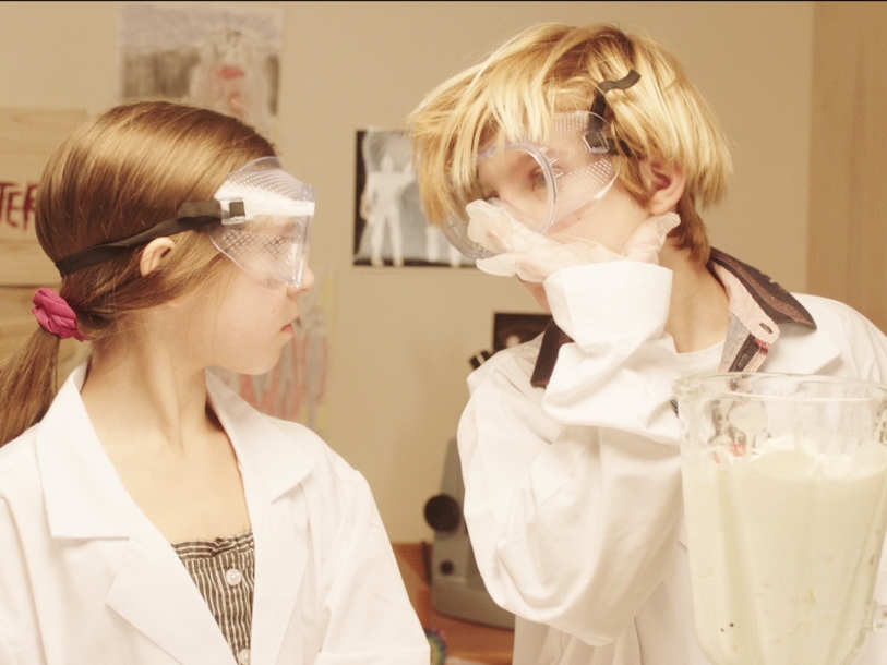 Film Still from The Pixie Fighters. Image of two woman dressed in protective eye gear.