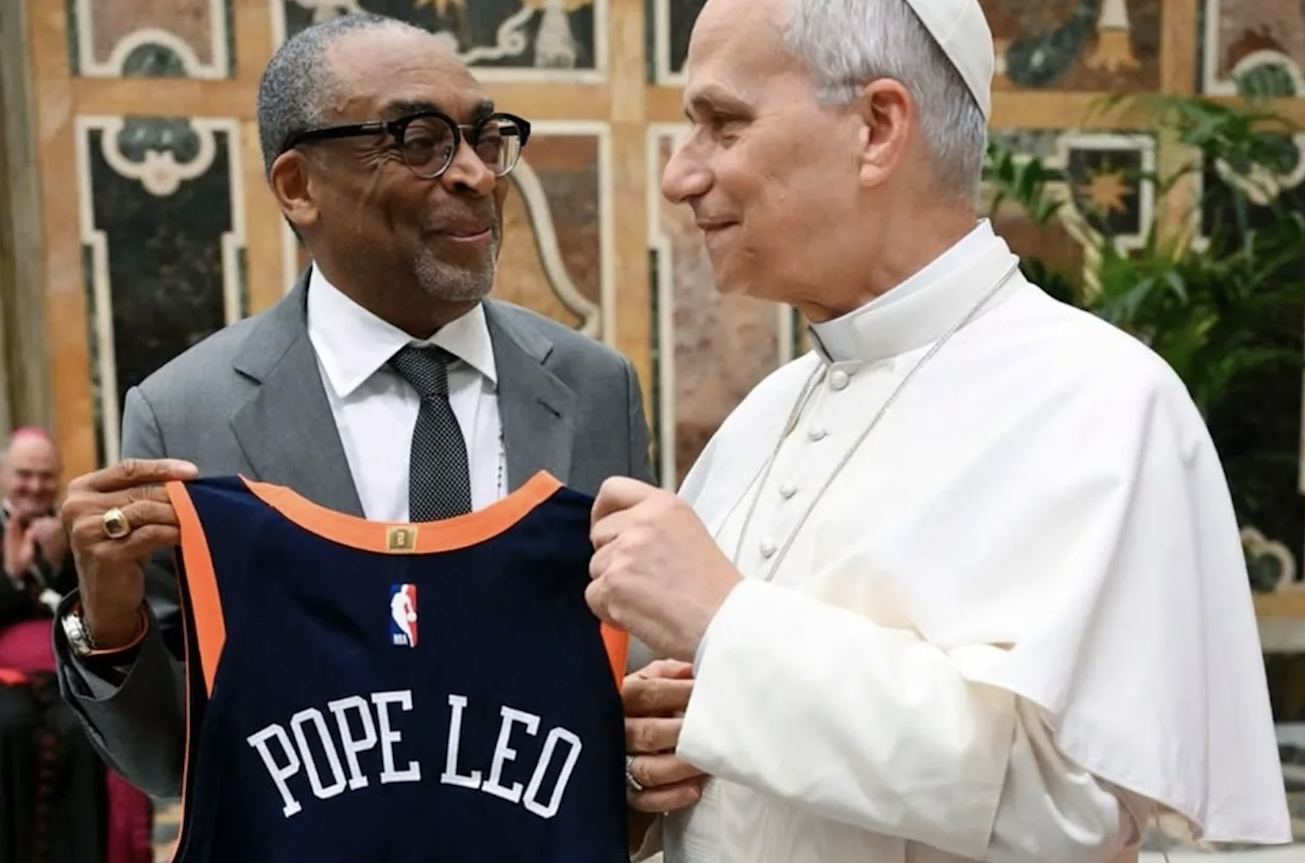 Professor Spike Lee gifts Pope Leo XIV a custom Knicks jersey with the Pope's name on it.