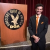 Bryan Uvaldo stands next to Directors Guild of America podium