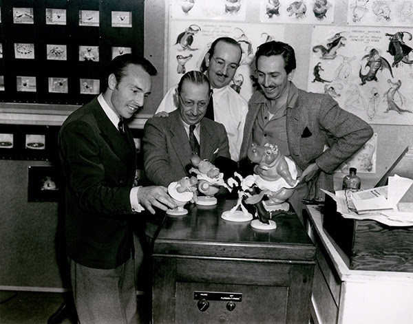 GEORGE BALANCHINE, IGOR STRAVINSKY, T. HEE, AND WALT DISNEY WITH CHARACTER MODEL STATUETTES, FANTASIA (1940); COLLECTION OF OLLIE JOHNSTON, COURTESY OF WALT DISNEY FAMILY FOUNDATION; © DISNEY