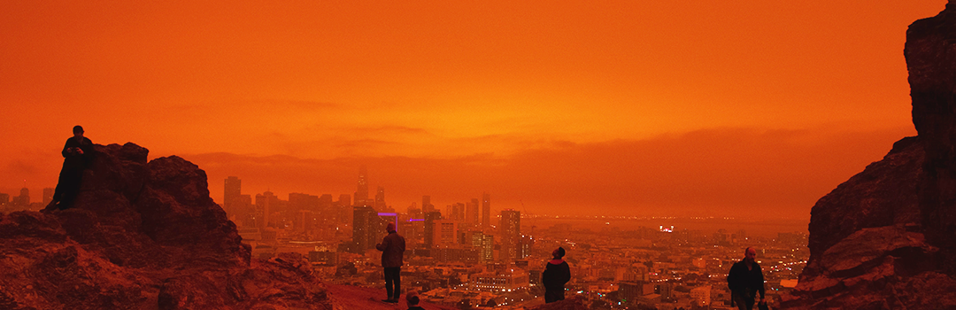 Silhouette of people overlooking San Francisco during 2020 fires