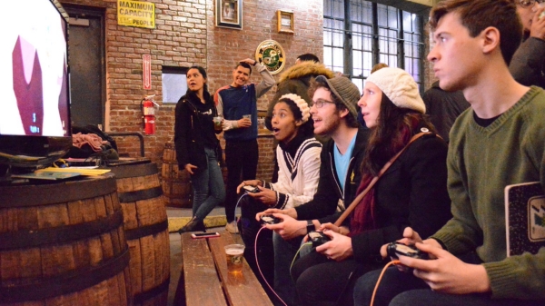NYU Game Center students play a game at Brooklyn Brewery