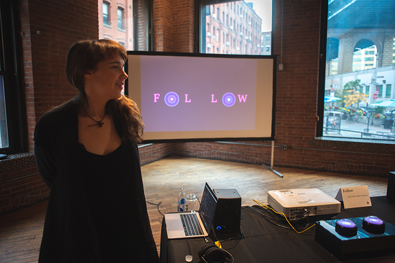 Marie Clarie LeBlanc Flanagan poses with her No Quarter game Follow