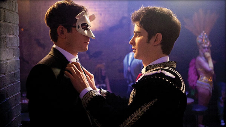 An image of two costumed men looking at each other.