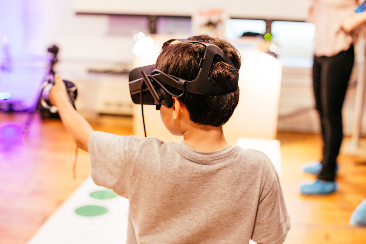 Child uses VR Equpiment