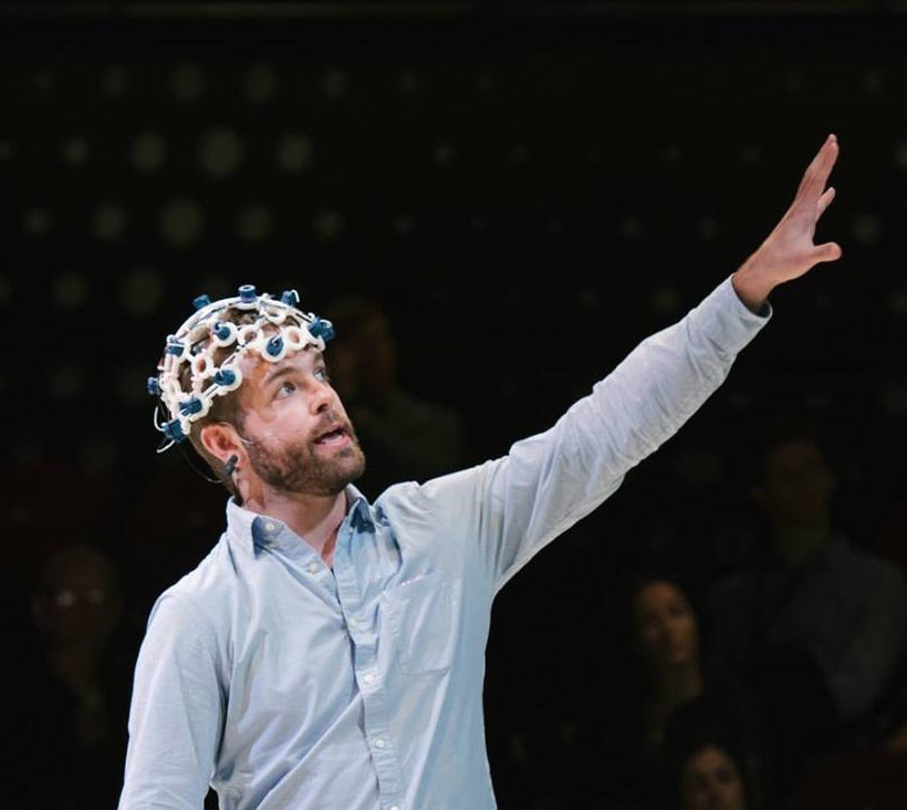 Image of Conor using technologic equipment on his head