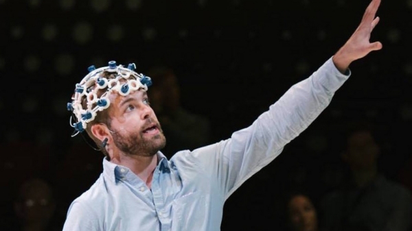 Image of Conor using technologic equipment on his head