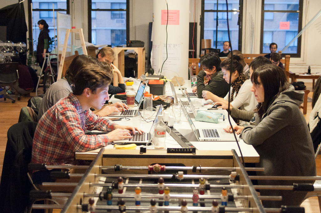 Students working around a table in the ITP Lounge