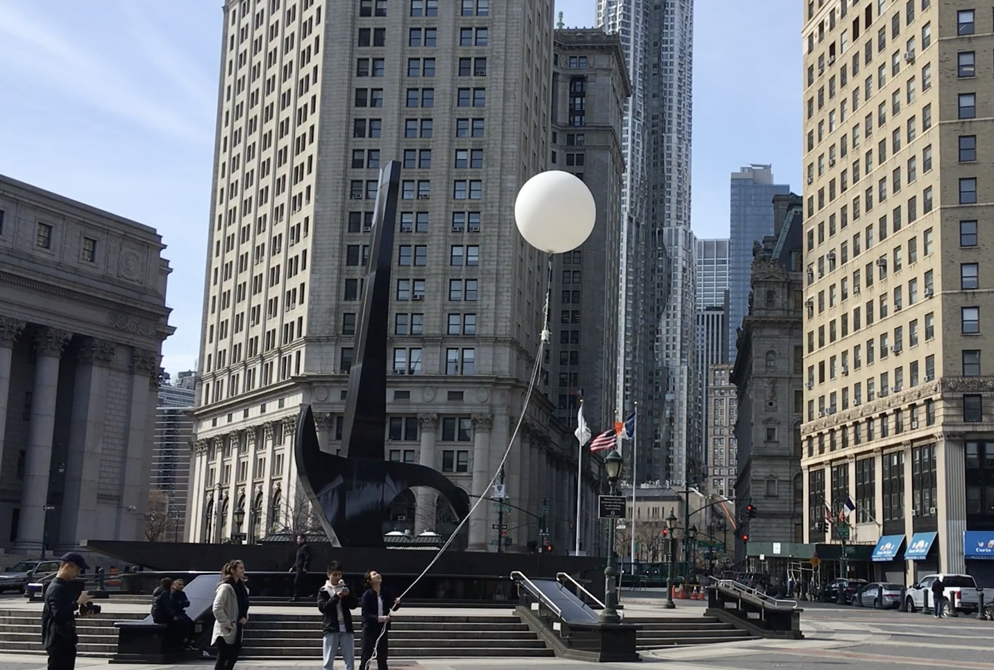 Woman holds balloon up in NYC
