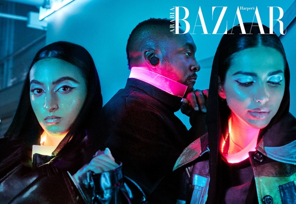 Will.i.Am and two models wear glowing clothing on the cover of Harper's Bazaar Arabia