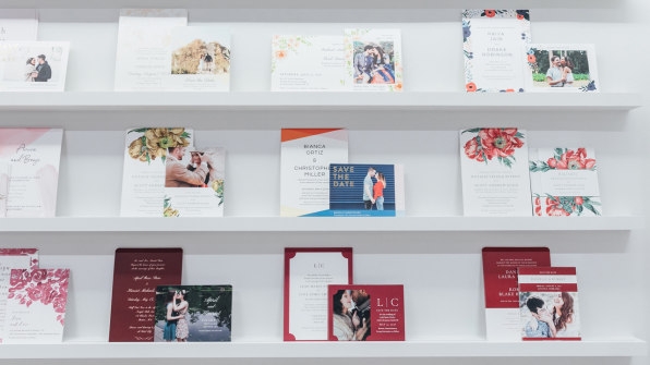 Wedding invitations on shelves in the Zola store