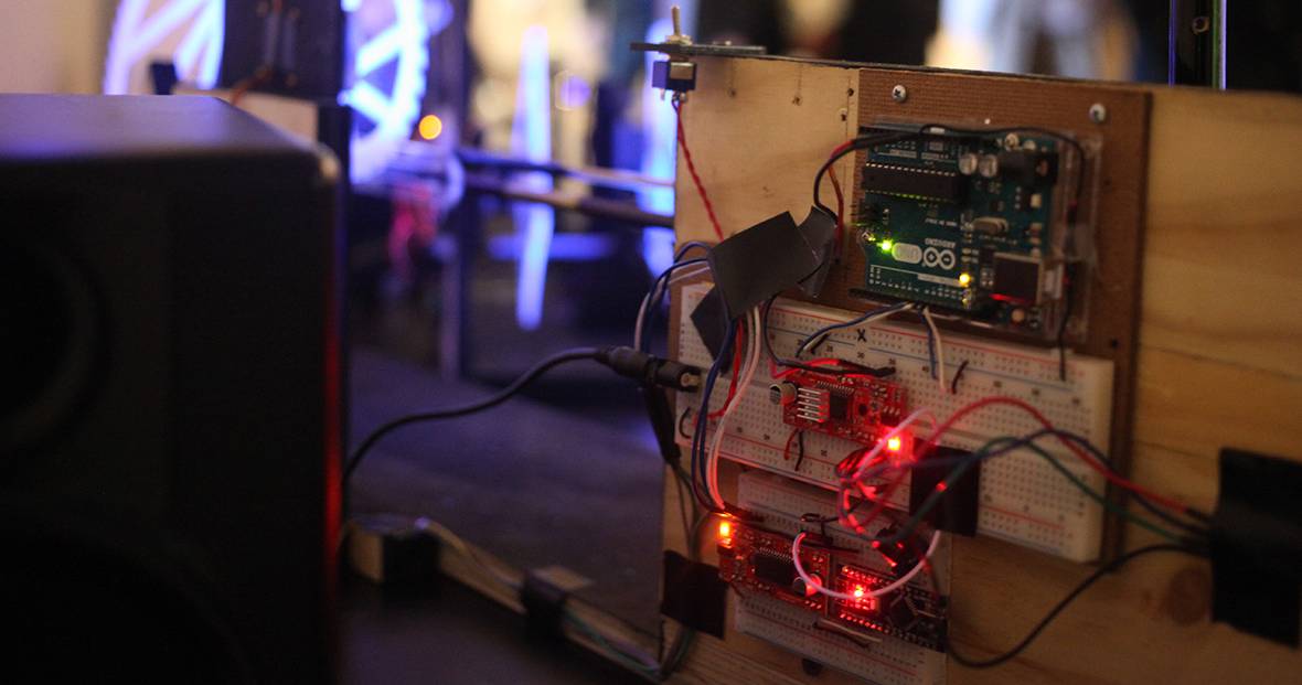An Arduino board wired and lit up.