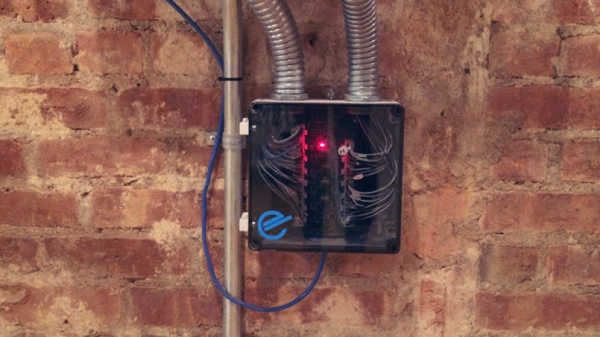 an electrical panel in a brick wall