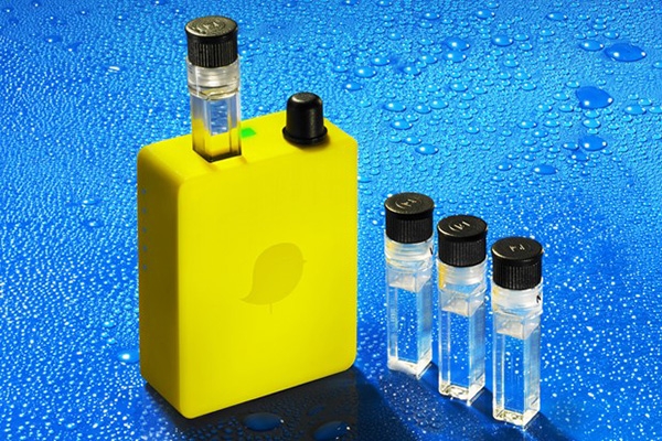 a yellow container with 3 smaller vials of water