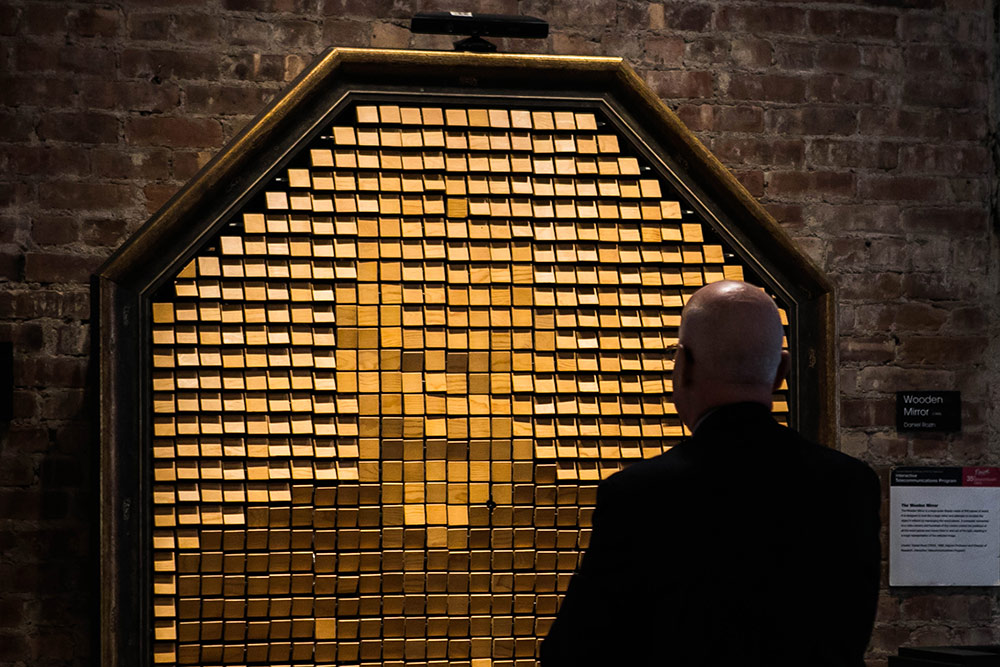 Image of someone in front of the ITP wooden mirror