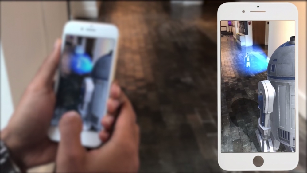 Image of an Iphone pointed at a corridor, augmenting a hologram through the camera