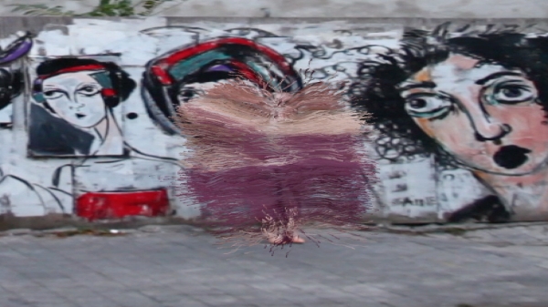 A screenshot of work by Zachary Lieberman, showing art superimposed over an outdoor scene using AR