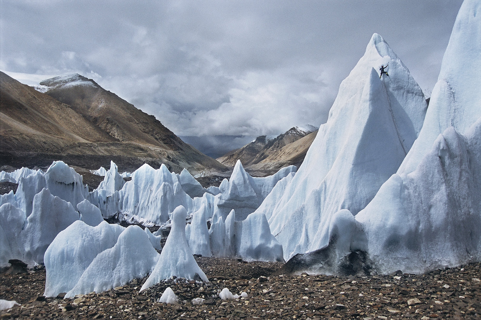 Man climbs a melting glacier