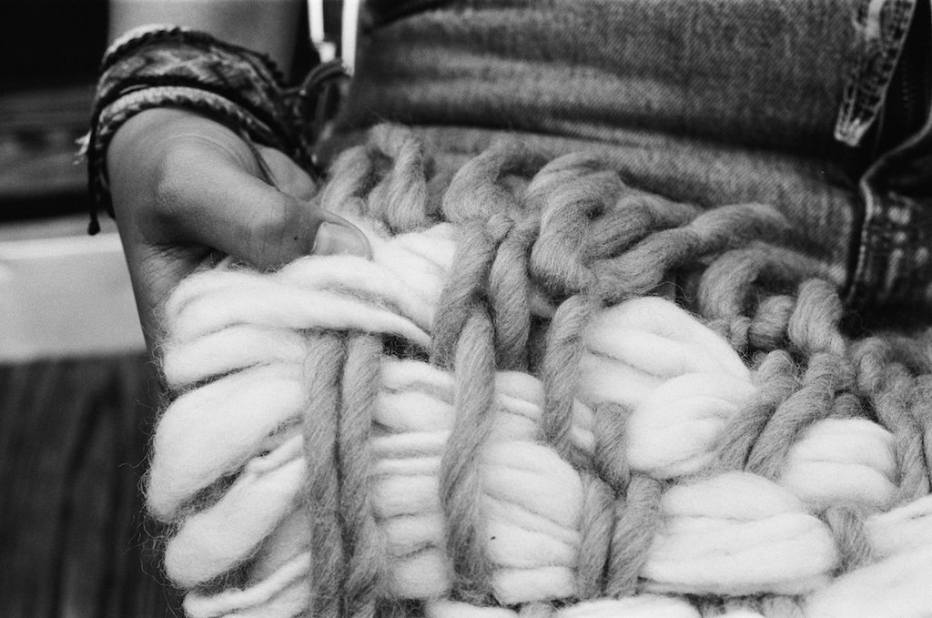Francesca's hands working with fibers