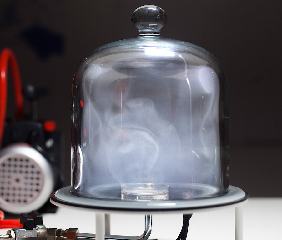 A large glass container with smoke inside