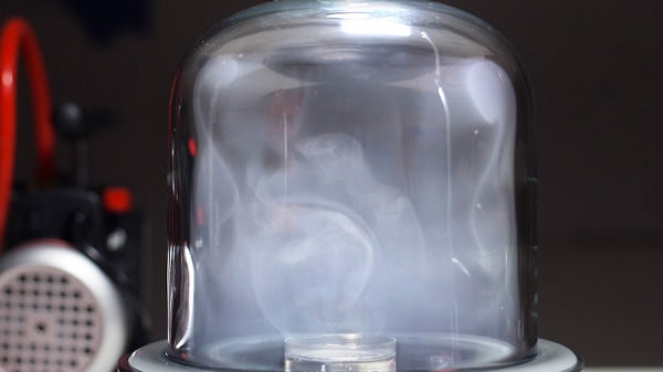 A large glass container with smoke inside