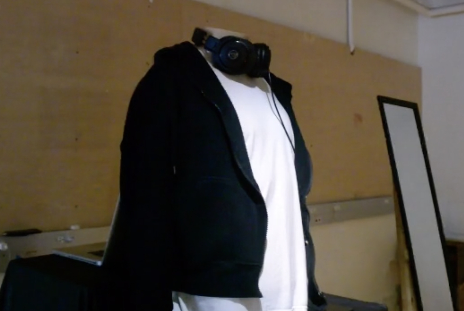 Misunderstood Project of a hoodie on a mannequin with a pair of headphones around the neck