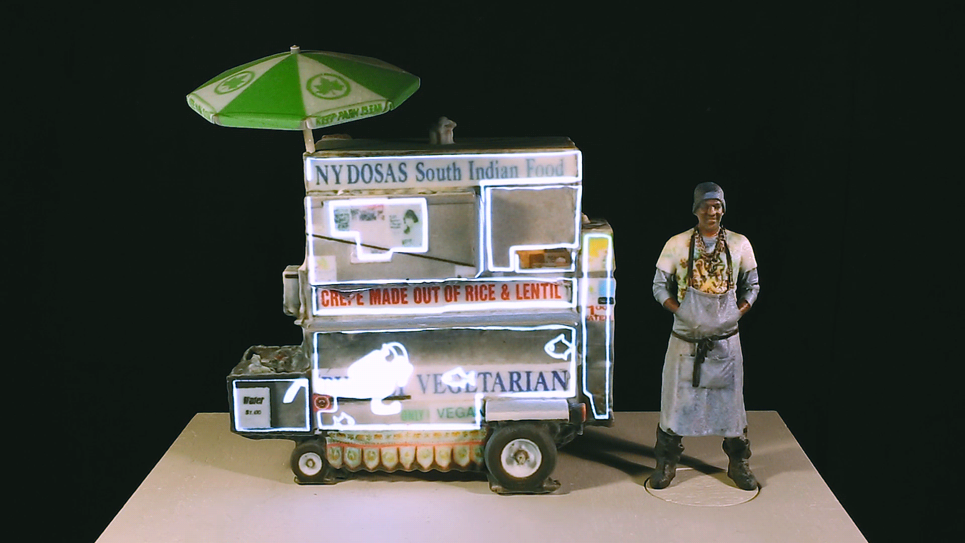 Three miniature food cart models