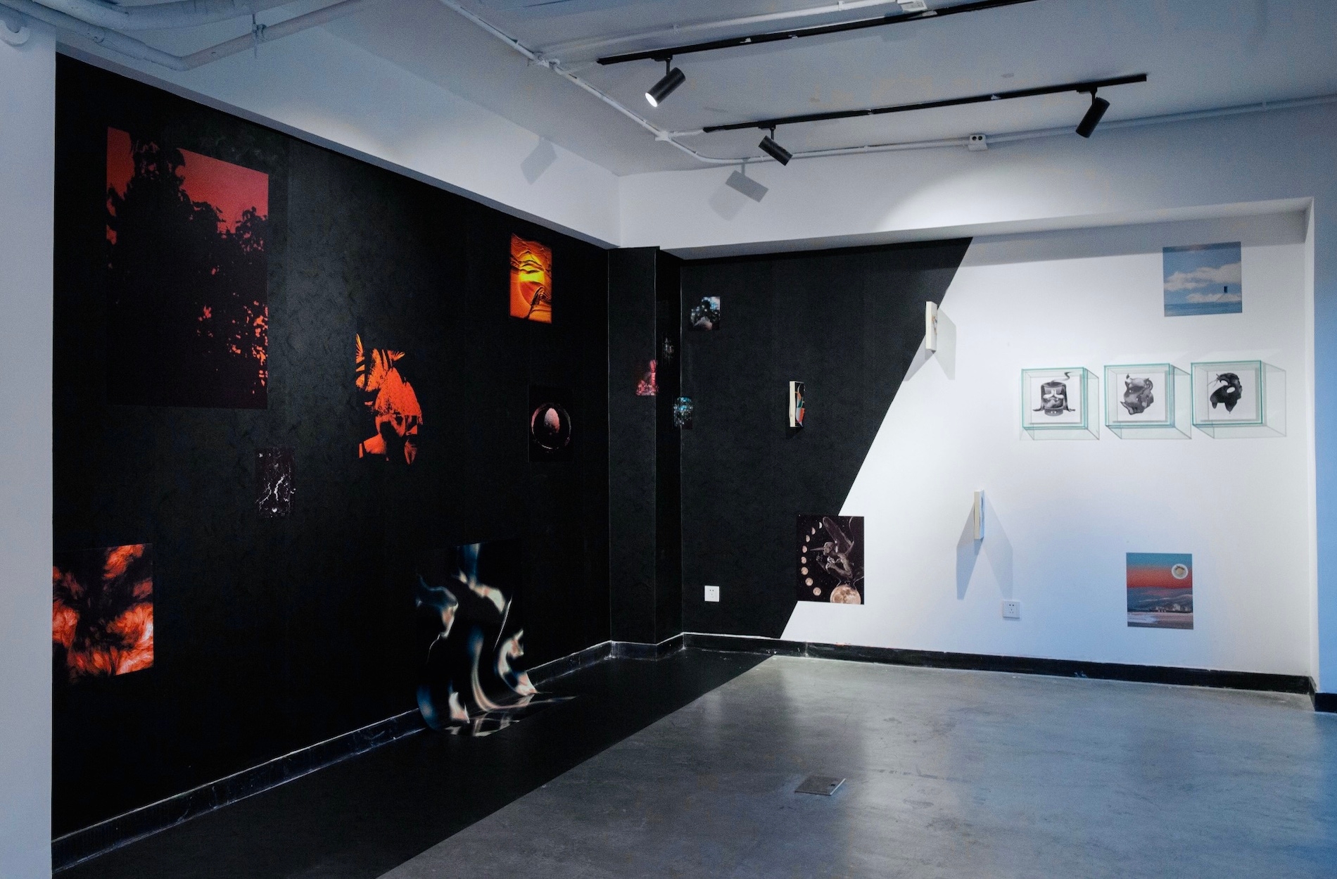 A photo of an indoor space with prints of computer generated imagery on the walls