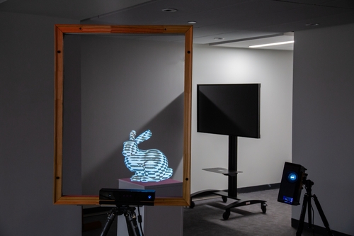 A window with a virtual digital rabbit projected onto it.
