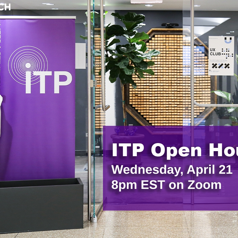 A photo of an open glass door with an ITP banner to the left and a brightly colored fake skeleton on the far left side