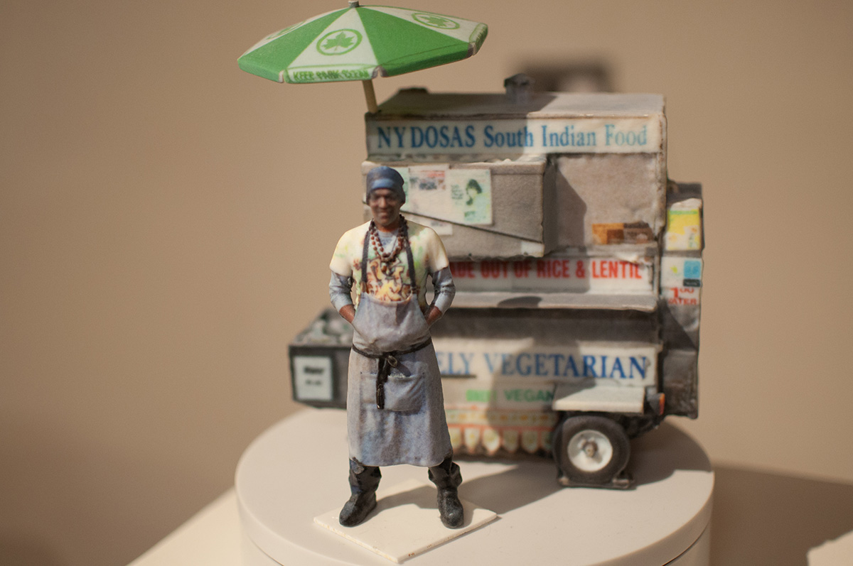 A miniature model of a food truck vendor