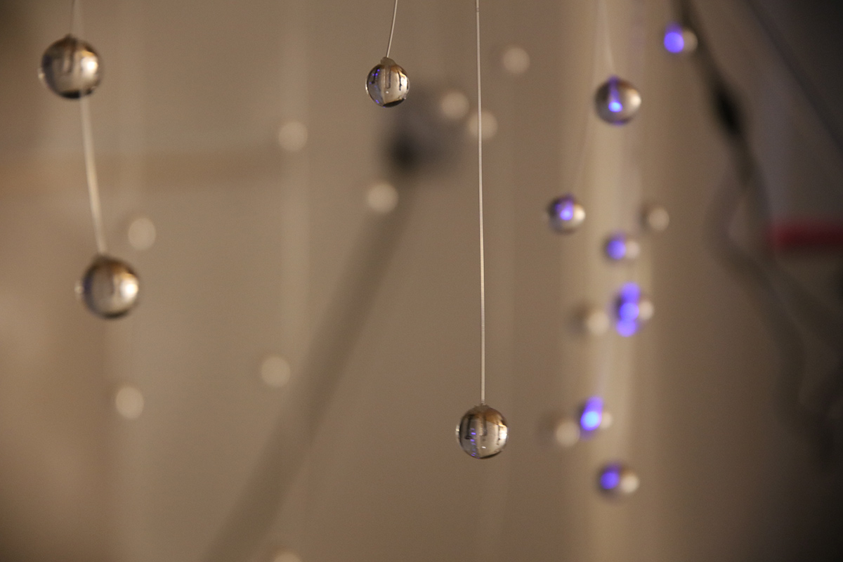 clear beads suspended in mid-air