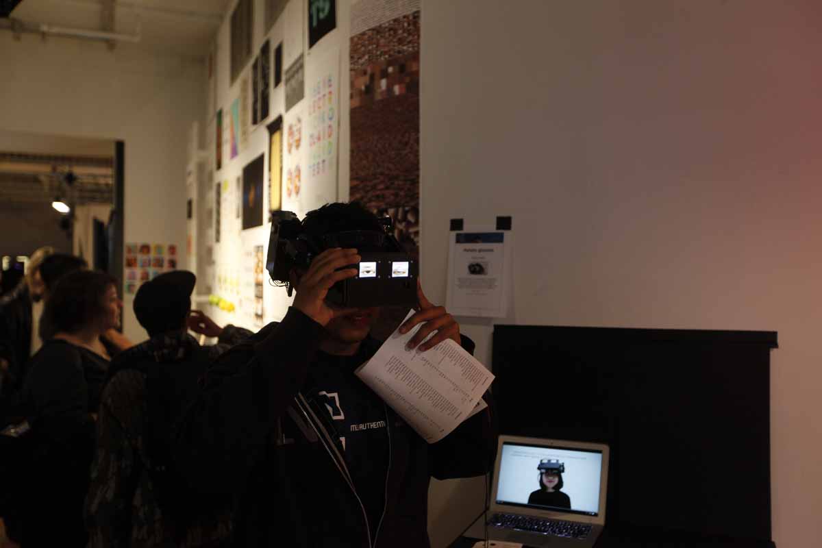 a person wearing a headset that shows video of eyes on the outside