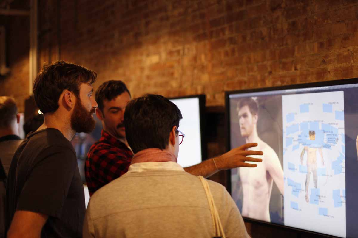 a man explaining his project on the screen