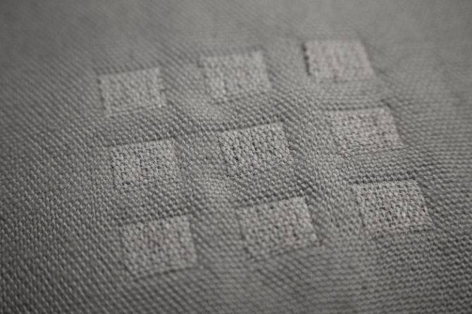 closeup of squares woven into a textile