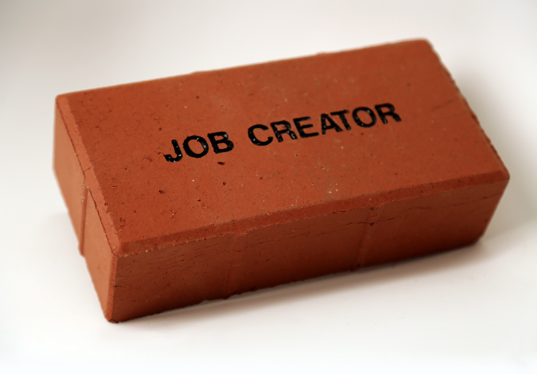 a brick with the words "job creator"