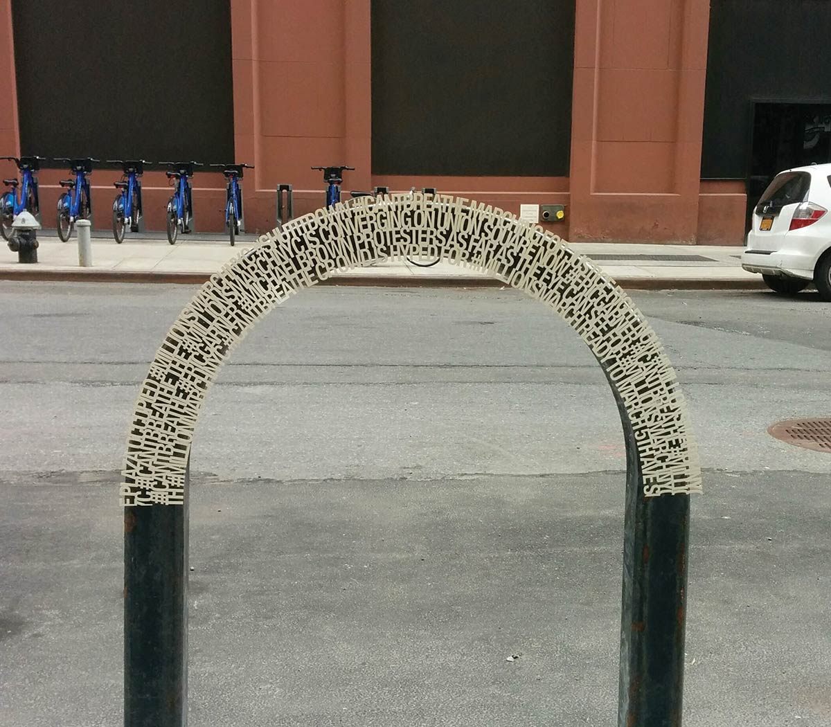 words printed on the top of a bike rack