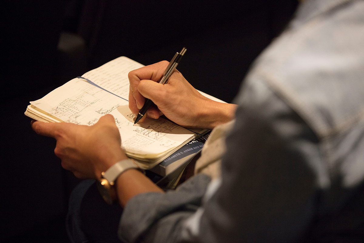 Writing in a notebook